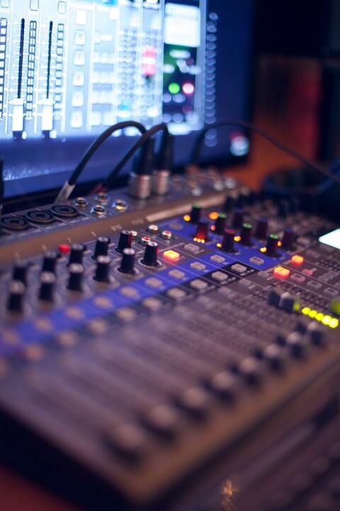 turned-on-audio-mixing-console