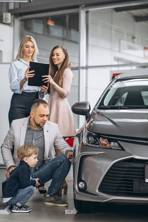 family-with-son-choosing-car-car-showroom