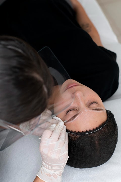 young-woman-going-through-microblading-procedure