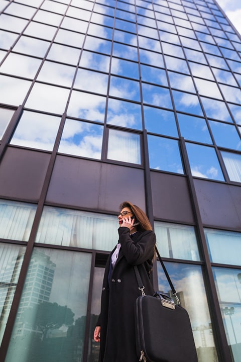 business-woman-black-talking-by-phone-outside