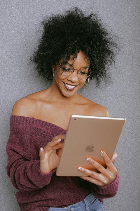woman-in-purple-off-shoulder-top-holding-an-ipad